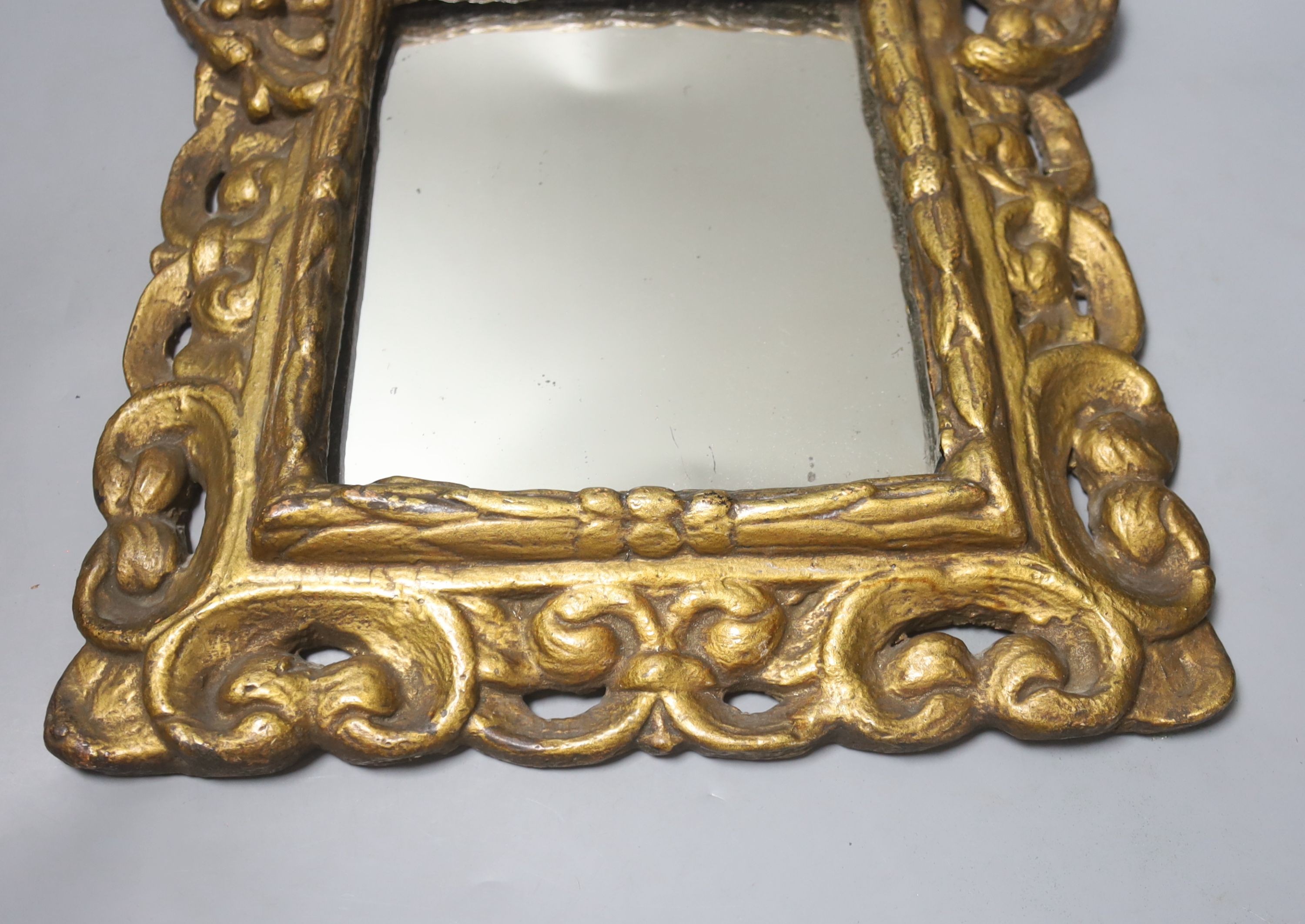 A 19th century gilt composition rectangular mirror in the Baroque style